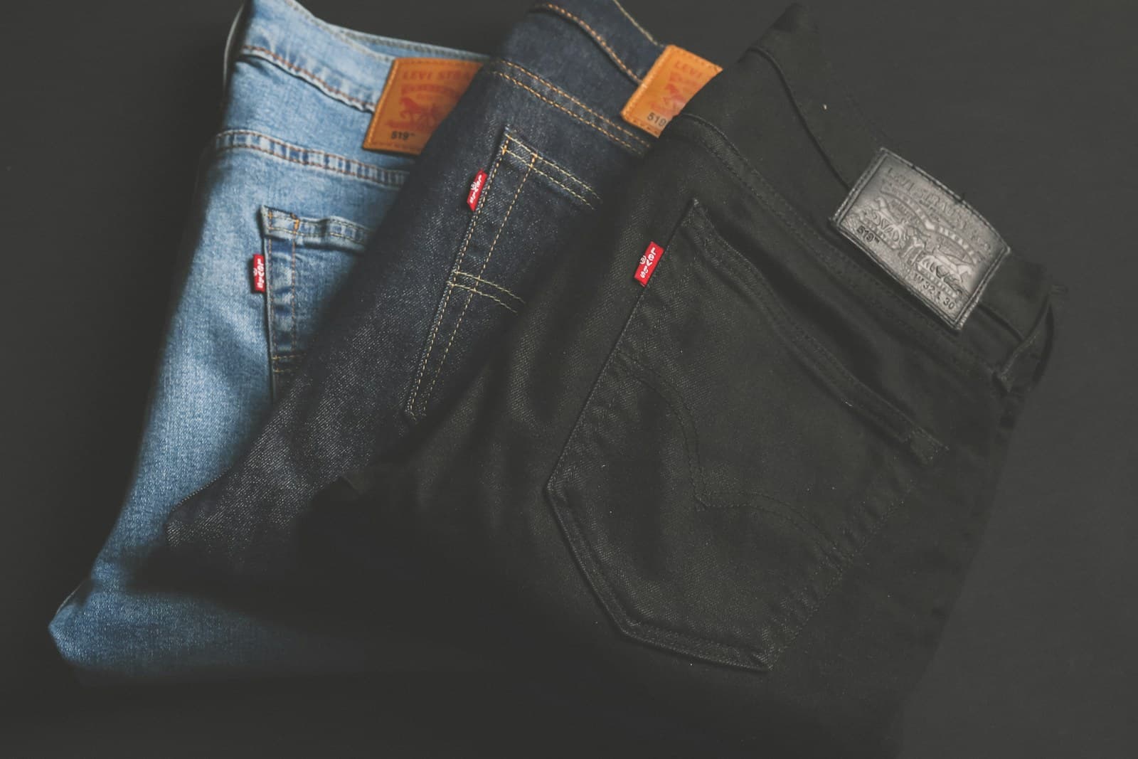 Stack of folded denim jeans in wholesale warehouse